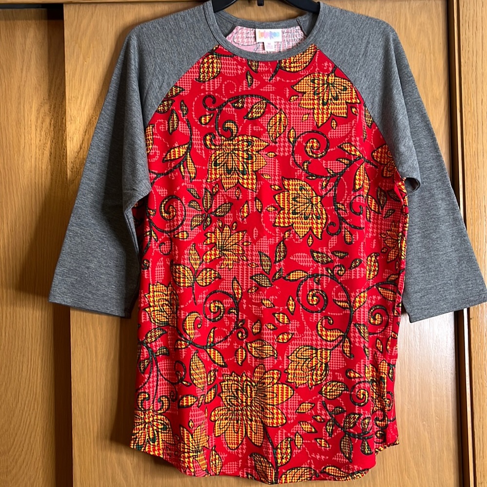 Lularoe Randy style shirt with a floral pattern, size medium